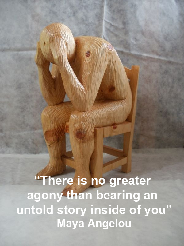 Wooden carved figure sitting with head in hand, with the Maya Angelou quote: There is no greater agony than bearing an untold story inside of you